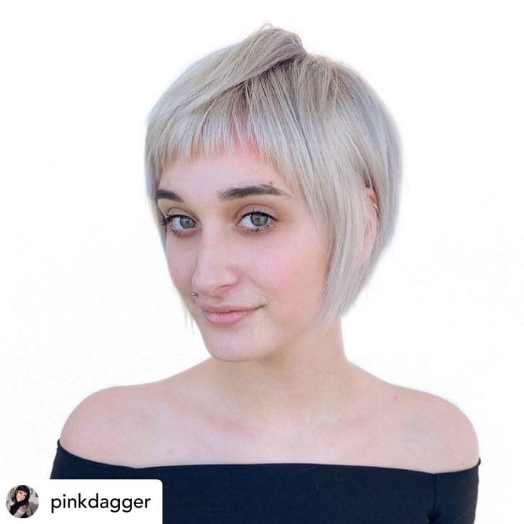 Beautiful woman with short bob and baby bangs.
