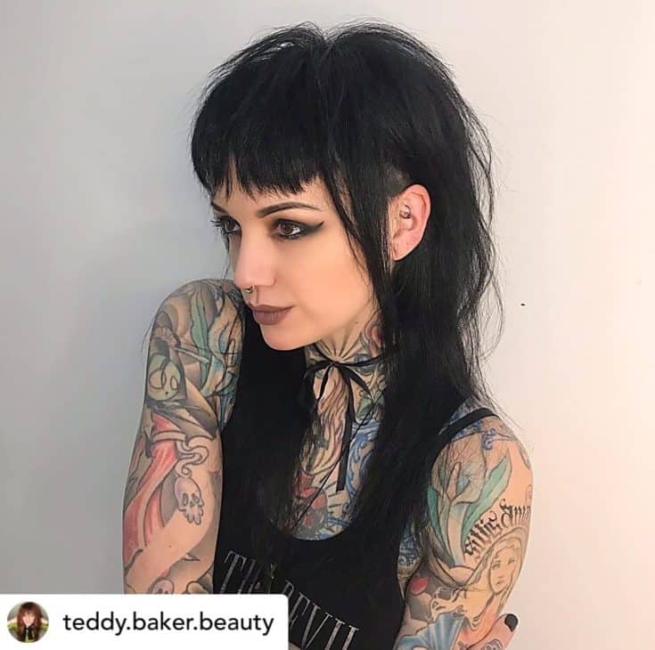 Beautiful woman with shag haircut and baby bangs.
