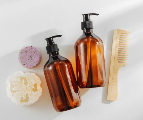 Hair products on a white surface.