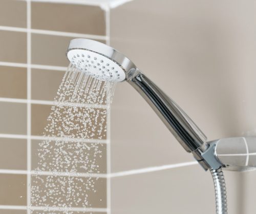 Water coming out of a shower head.