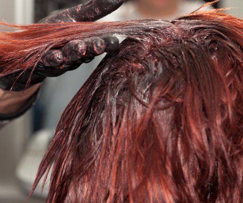 Woman having hair colored.