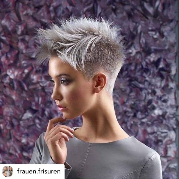 Woman with a short pixie haircut.