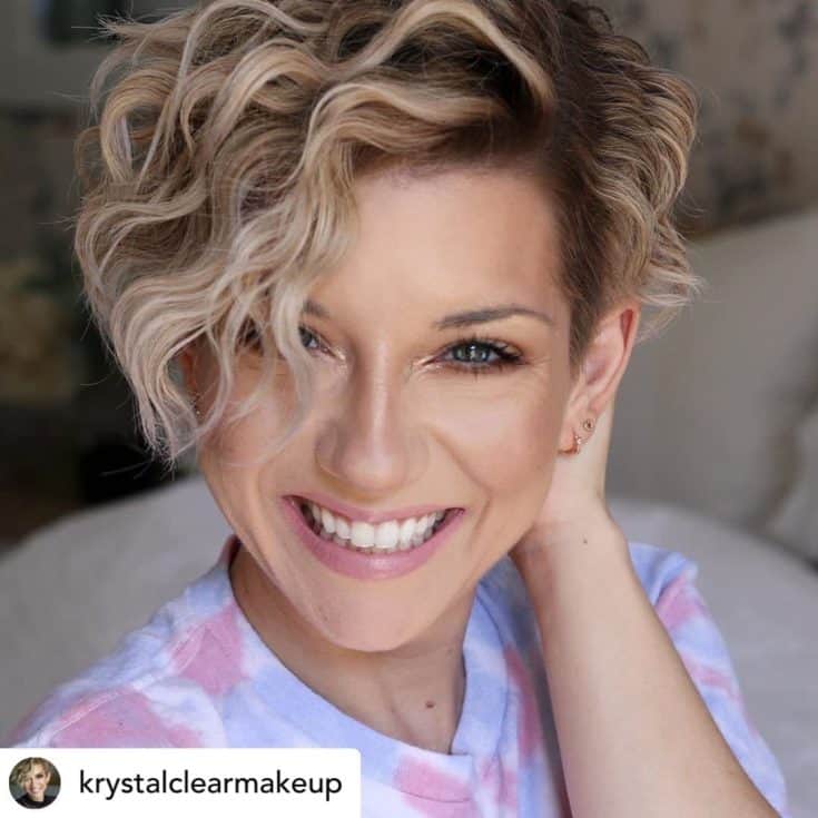 Woman with a short pixie haircut.