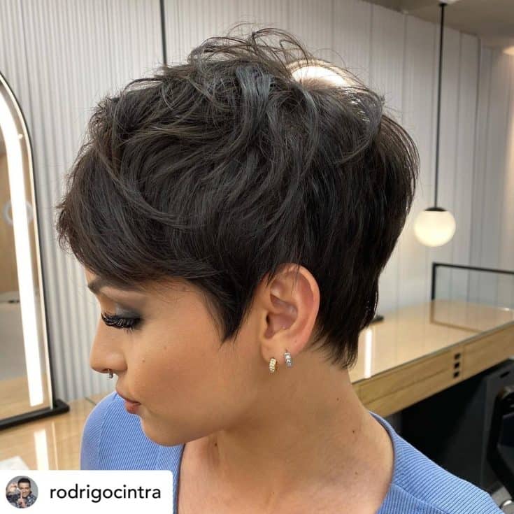 Woman with a short pixie haircut.