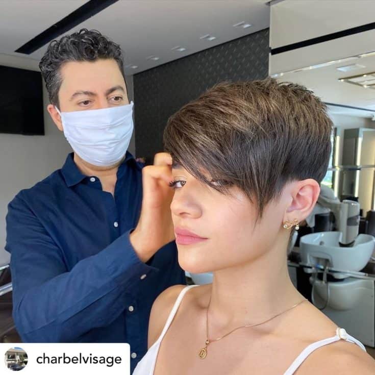 Woman with a short pixie haircut.