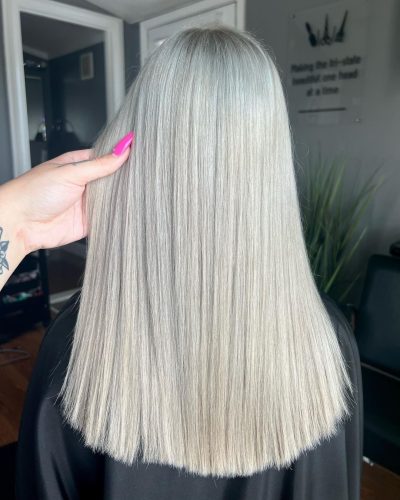 Beautiful ash blonde hair color on long straight hair.