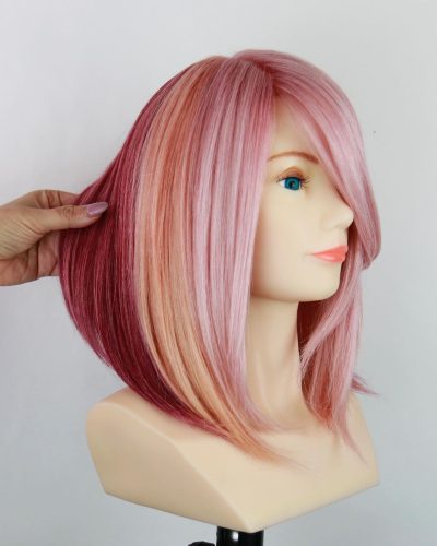 Beautiful dusty rose pink hair color on length bob haircut.