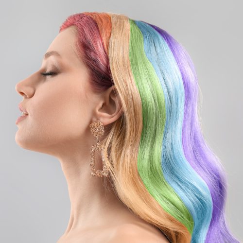 Gorgeous rainbow hair color on long wavy hair.