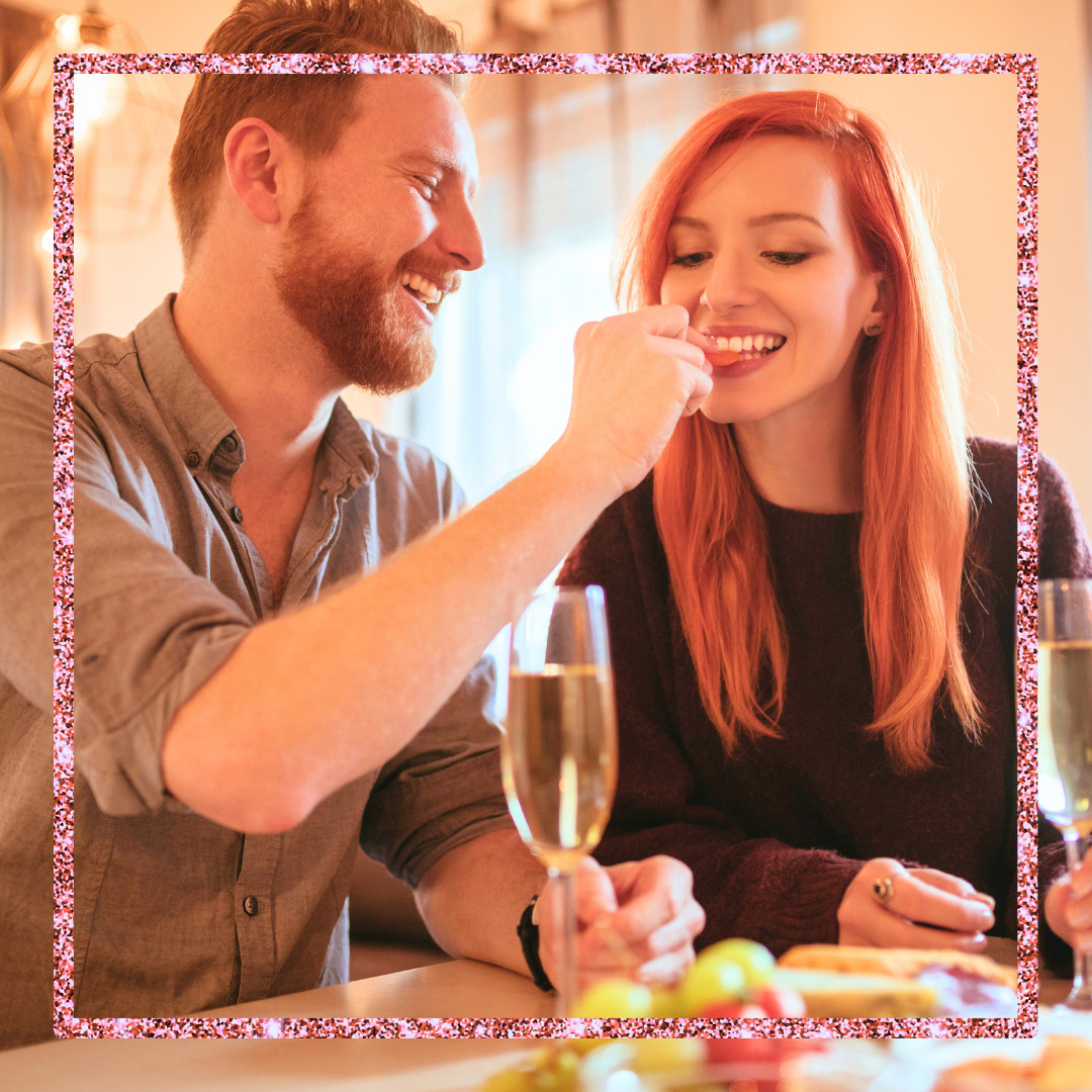 Cute couple enjoying a date night dinner and wine.